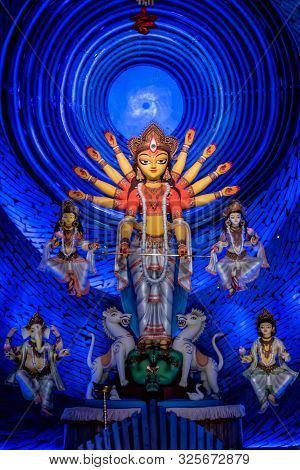 Goddess Durga Idol At Decorated Durga Puja Pandal, Shot At Colored Light, At Kolkata, West Bengal, I