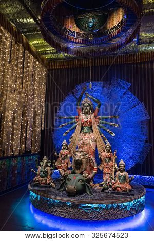 Goddess Durga Idol At Decorated Durga Puja Pandal, Shot At Colored Light, At Kolkata, West Bengal, I