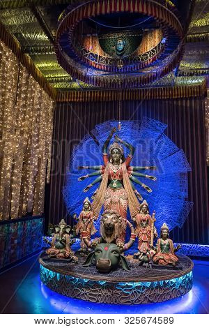 Goddess Durga Idol At Decorated Durga Puja Pandal, Shot At Colored Light, At Kolkata, West Bengal, I