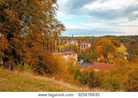 Scenic View To Muskau Castle And Famous Muskau Park At Autumn Morning, Germany. Unesco World Heritag