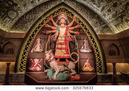 Goddess Durga Idol At Decorated Durga Puja Pandal, Shot At Colored Light, At Kolkata, West Bengal, I