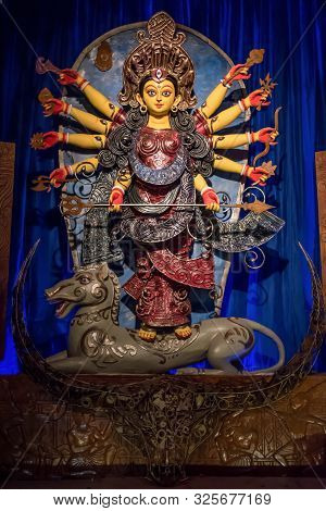 Goddess Durga Idol At Decorated Durga Puja Pandal, Shot At Colored Light, At Kolkata, West Bengal, I