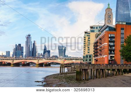 London at sunset with riverside buildings, Blackfriars Bridge and the City of London