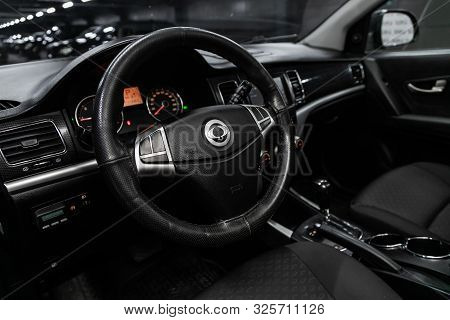 Novosibirsk, Russia - September 11, 2019:  Actyon Ssangyong, Black Luxury Car Interior - Steering Wh