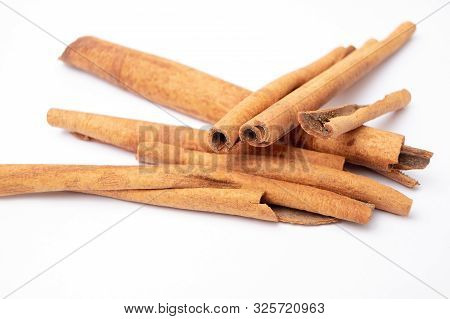 Cinamon. Organic Exotic Herbs And Spices On Isolated White Background.