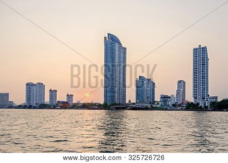 Bangkok, Thailand - April 18, 2018: Sunset And The Skyline Of The Downtown With Its Modern Buildings