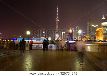 Shanhai, China - November 28, 2008: People At The Bund Riverside Looking At The Skyline Of Lujiazui 