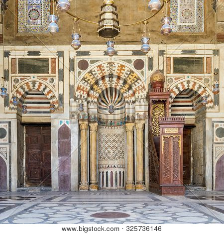 Cairo, Egypt- April 13 2015: Colorful Decorated Marble Wall With Mihrab - Niche - And Wooden Minbar 