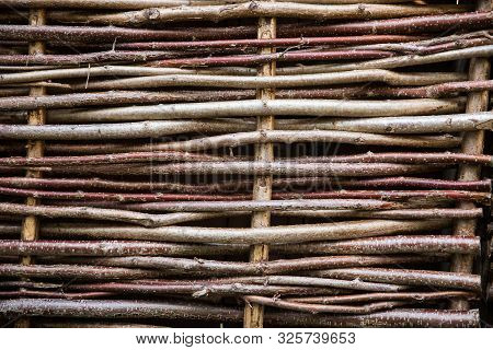 A Full Frame Background Of A Close Up Of Willow Or Hazel Tree Hurdle Fencing With Copy Space