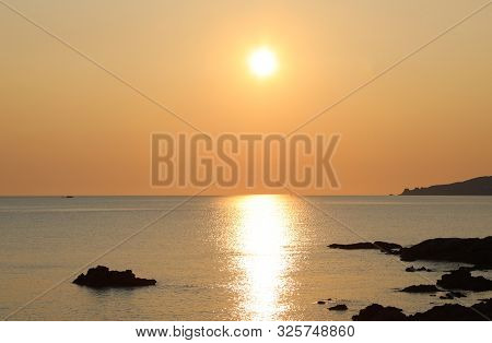 Golden Sun And The Reflection On The Water