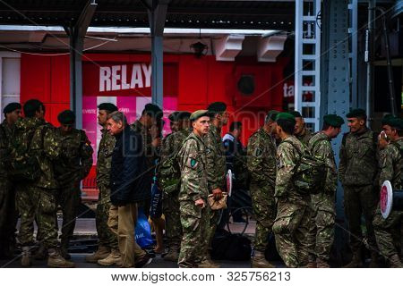Romanian Soldiers Waiting For A Train On The Platform Of Bucharest North Railway Station (gara De No
