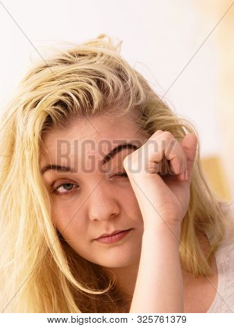 Young Blonde Female Feeling Dull And Tired After Waking Up. Woman Yawning Being Sleepy In Bathroom.