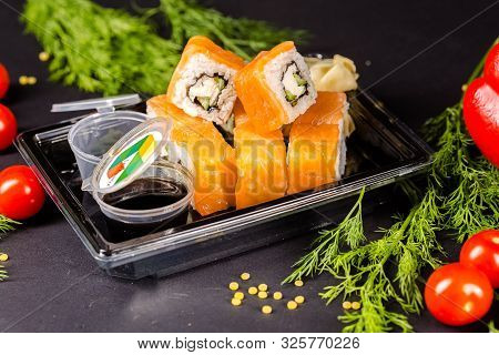 Russia Saint Petersburg Greenbox 01102019 Sushi Rolls Philadelphia Lies On A Square Stone Slate, Wit