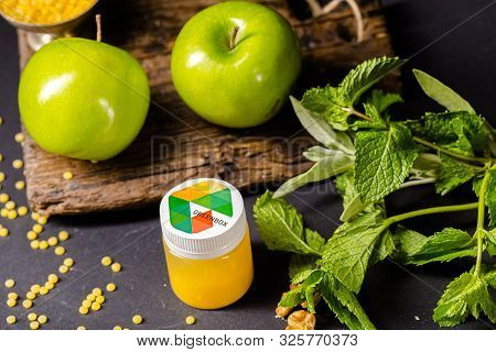 Russia St. Petersburg Greenbox 01102019 Energy Shot, Orange In A Plastic Container, Green Apples, Mi