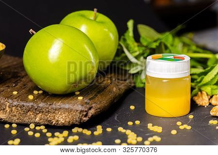 Russia St. Petersburg Greenbox 01102019 Energy Shot, Orange In A Plastic Container, Green Apples, Mi