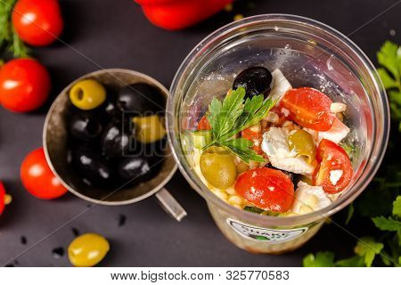 Russia St. Petersburg Greenbox 01102019 Italian Salad With Olives, Cereals, In A Plastic Container, 