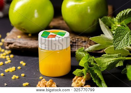 Russia St. Petersburg Greenbox 01102019 Energy Shot, Orange In A Plastic Container, Green Apples, Mi