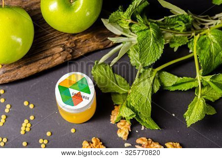 Russia St. Petersburg Greenbox 01102019 Energy Shot, Orange In A Plastic Container, Green Apples, Mi