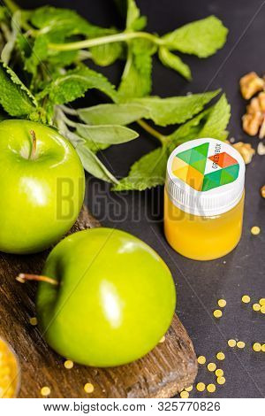 Russia St. Petersburg Greenbox 01102019 Energy Shot, Orange In A Plastic Container, Green Apples, Mi