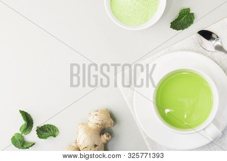 Top View Of Green Tea Matcha In A White Mug. Matcha Ginger Latte. Rich Source Of Antioxidants And Po