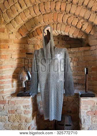 Chain Mail Of A Medieval Knight Against Stone Wall