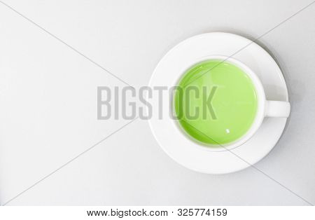 Top View Of Green Tea Matcha In A White Mug. Matcha Ginger Latte. Rich Source Of Antioxidants And Po