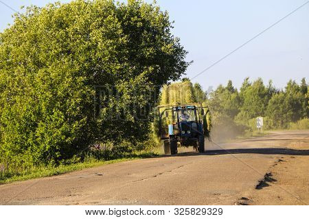 Tractor Driven Fresh Hay Rolled, After Seasonal Harvesting