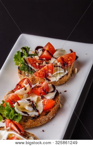 Bruschetta With Tomatoes, Lettuce, Camambert, Balsamic Vinegar