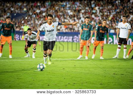 VALENCIA, SPAIN - OCTUBER 2: Parejo kicks a penalty during UEFA Champions League match between Valencia CF and AFC Ajax at Mestalla Stadium on Octuber 2, 2019 in Valencia, Spain