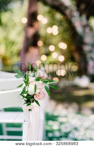 Stylish Little Boutoniere Of Natural Colors And Greens Against A Blurred Background