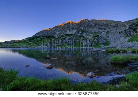Mountain Landscape And Glacial Taul Portii Lake In Retezat National Park, Carpathian Mountains, Roma