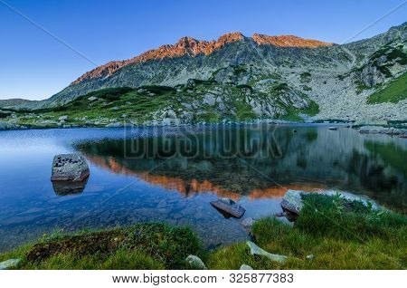 Mountain Landscape And Glacial Taul Portii Lake In Retezat National Park, Carpathian Mountains, Roma