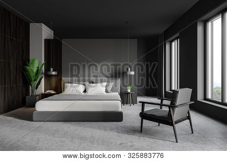 Gray Master Bedroom With Armchair