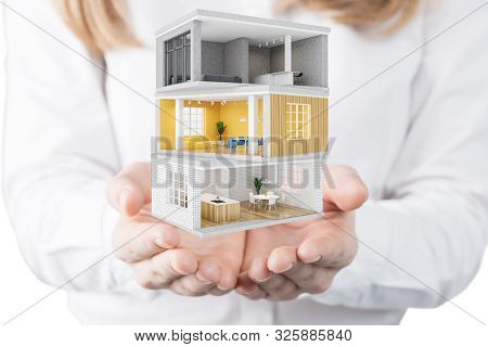 Young Woman Architect Holding Project Of Modern House With Different Rooms. Concept Of Design And De