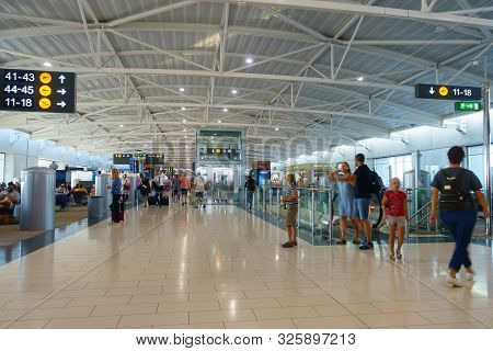 Passengers Pass Passport Control In Larnaca International Airport