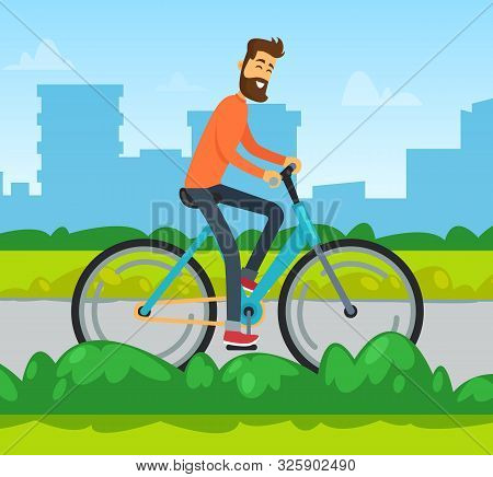Smiling Man On Bicycle, Skyscraper View, Male Cycling. Person On Urban Transport, Cycler Going By Ro