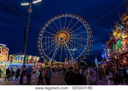 Munich, Germany - 2019, September 24: Visitors From All Over The World Walking In Front Of The Ferri