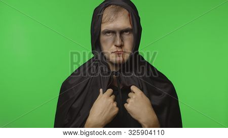 Executioner Halloween Man Portrait. Guy With Dripping Blood On His Face. Executioner, Headman Makeup