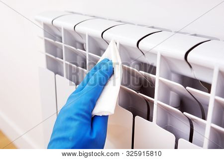Disinfection In Public Places, The Fight Against The Virus, Coronavirusthe Worker's Hand Wipes The W