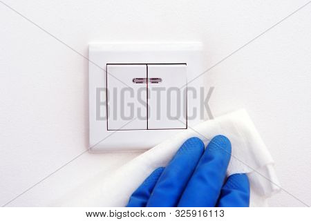 Disinfection In Public Places, The Fight Against The Virus, Coronavirusthe Worker's Hand Wipes The W