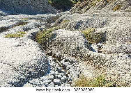 Muddy Volcanoes Paclele Mari Near Buzau, Romania. Mud And Natural-gas Eruptions Create Small Volcano