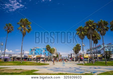 June 10, 2019. Los Angeles, Usa. Venice Beach Broadwalk View In California With Palm Trees And Clear