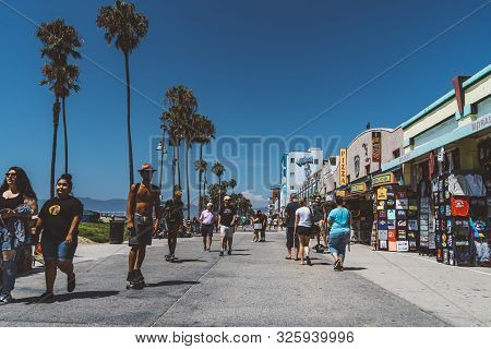 June 10, 2019. Los Angeles, Usa. Venice Beach Broadwalk View In California With Palm Trees And Clear