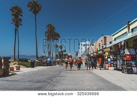 June 10, 2019. Los Angeles, Usa. Venice Beach Broadwalk View In California With Palm Trees And Clear