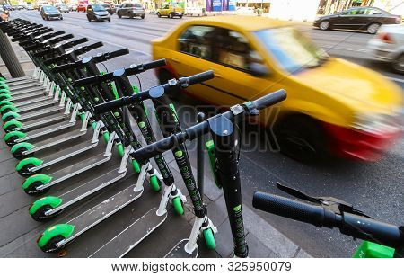 Bucharest, Romania - September 29, 2019: Several Lime-s Electric Scooters Are Parked On A Sidewalk I