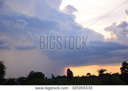 Sun Rise And Sun Set Background, Yellow, Black And Orange Clouds In The Sky.
