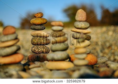 Close up of rocks stacked one on top of another with soft selective focus and blurred rocks backgrou