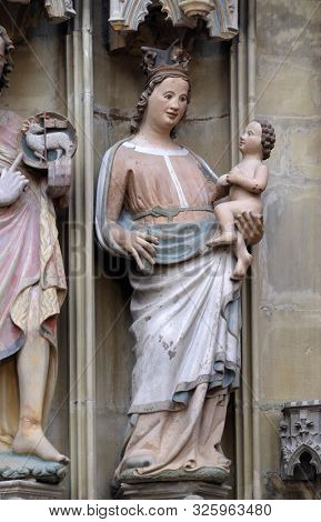 ROTHENBURG, GERMANY - JULY 16, 2019: Virgin Mary with baby Jesus, statue on the tabernacle in St James Church in Rothenburg ob der Tauber, Germany
