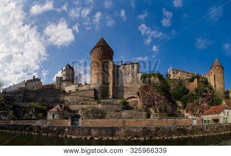 Panorama Of The Old City Of Semur-an-osua. Burgundy. France. In The Foreground Is The Armankon River