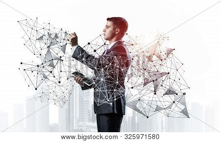 Business Person Pointing On Abstract Network Structure. Standing Personal Assistant In Business Suit